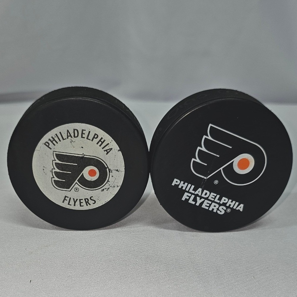 Philadelphia Flyers NHL Hockey Pucks Lot of 2 Vintage In Glas Co & Modern Logo